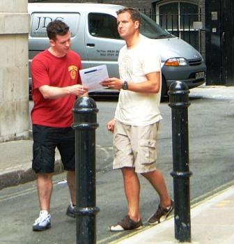 Two men following an Eastern City Clue on their Treasure Hunt.