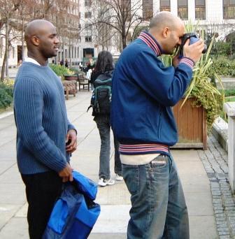 Man taking a photograph as a treasure hunt challenge.