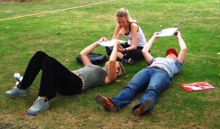 3 girls lie down to rest on the treasure hunt.