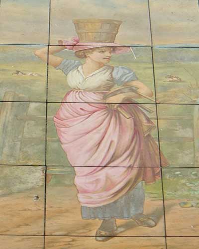A wall painting showing an 18th century milkmaid.