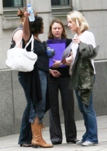 A group of women discuss their treasure hunt clue.