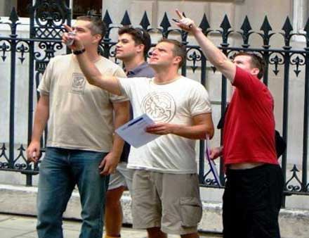 A team pointing up at a clue.