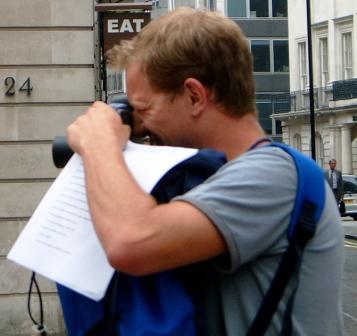 Man taking a photo on a treasure hunt.