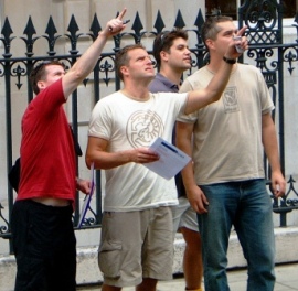 Pointing up at a clue on the City Treasure Hunt.