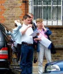 Team study a clue on the London Treasure Hunt.