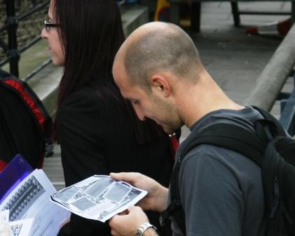 A man studies a clue.
