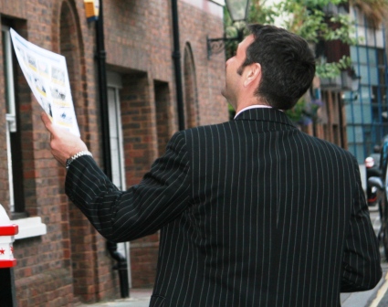 Man studies kensington Treasure Hunt clue.