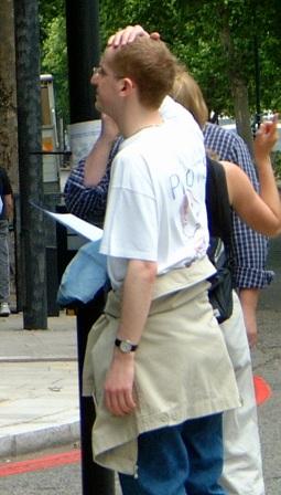 Man puts hand on head as he ponders the next treasure hunt clue.