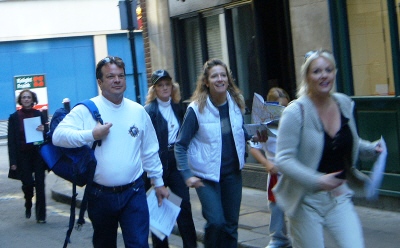 People following a clue in London street.