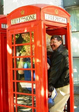 Team inside a phone box.