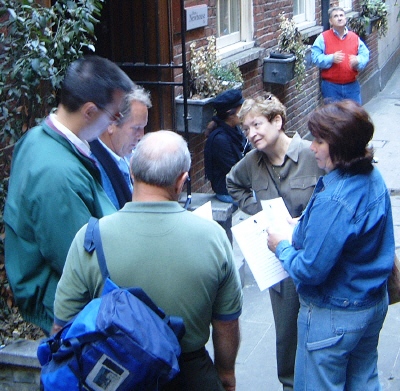 A group discussing a clue on the riverside treasure hunt.