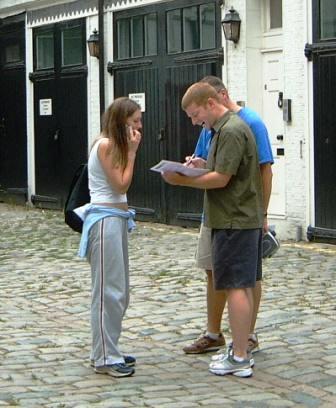 Group reading a treasure hunt clue in London.