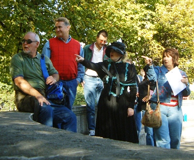 Woman pointing to a treasure hunt clue.