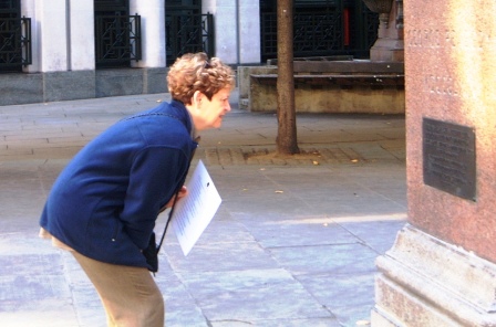 Spitalfields Treasure Hunt woman reads a clue.