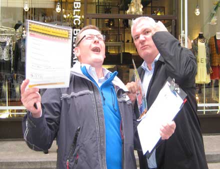 Two men perform one of their team's pose challenges.