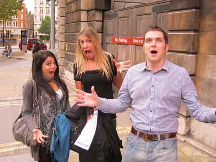 Three people acting surprised as one of their pose challenges.
