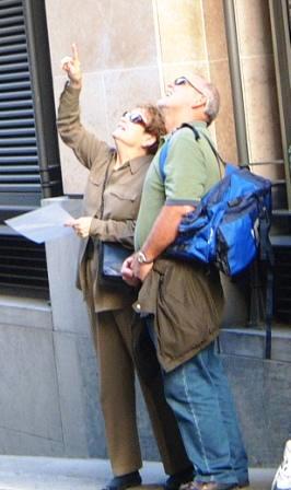 Couple looking up at a clue on the Covent Garden Treasure Hunt.