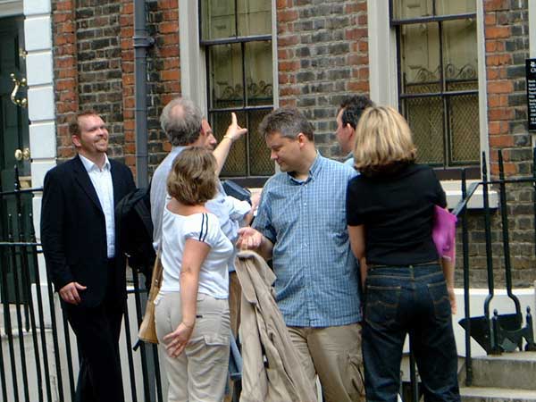 A team studying a clue outside Thomas Carlyle's House in Chelsea.