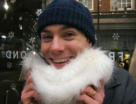 A team member collecting a white beard for his scavenger challenge.