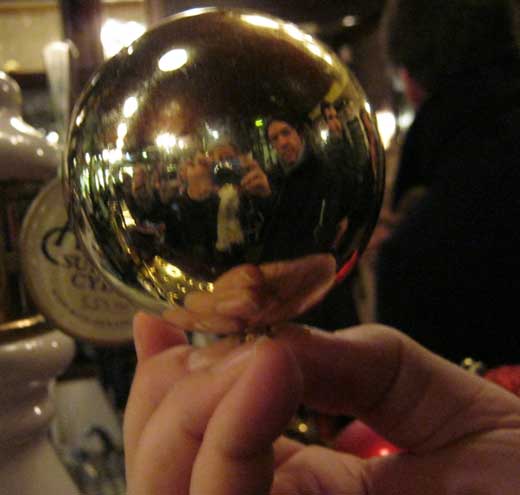 A team member holds a Christmas decoration.