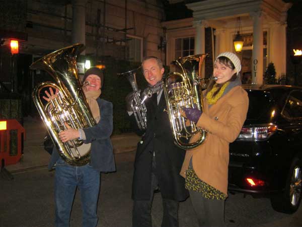 Three members of a team playing musical instruments.