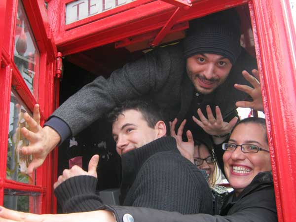 A team posing in a phone box as part of their South Bank Treassure Hunt.