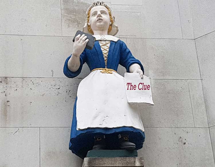 The statue of a charity girl wearing a blue dress and white apron that forms one of the treasure hunt clues..